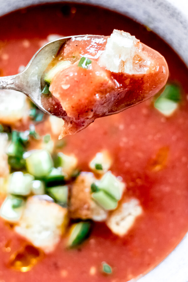 close up on spoon of Healthy Charred Gazpacho