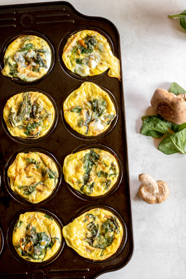 gut healthy egg muffins with kimchi and veggies inside muffin tray