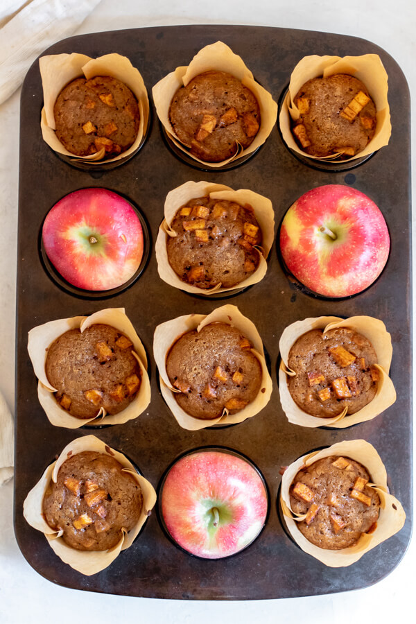 full muffin tray with apples and apple spice muffins