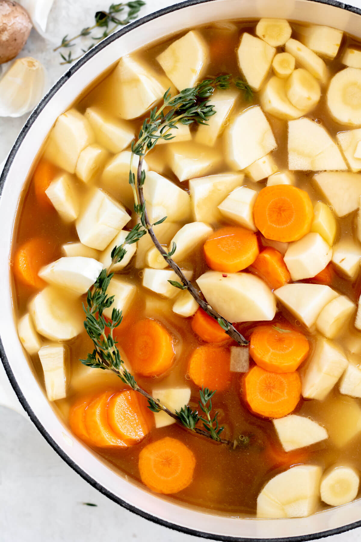 root vegetables in white pot