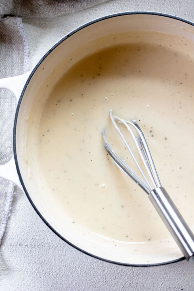 Large white pot of healthy cheese sauce