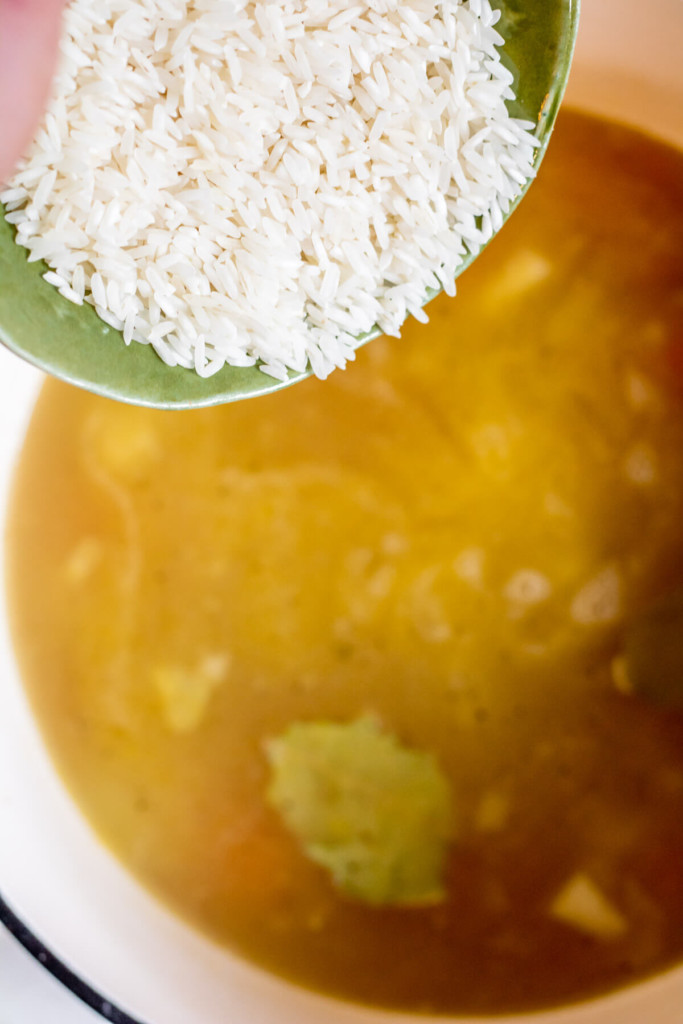 adding rice to lemon rice soup