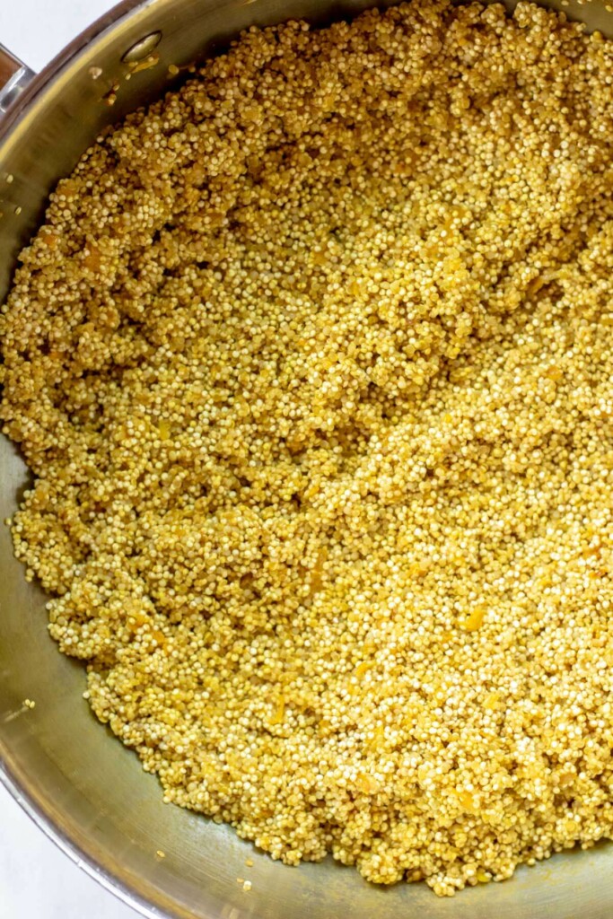 close up shot of quinoa cooking with turmeric