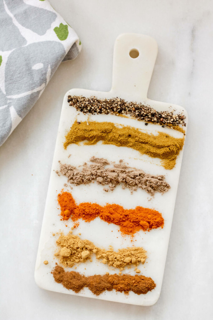 dried spices on a white marble slab on a white background