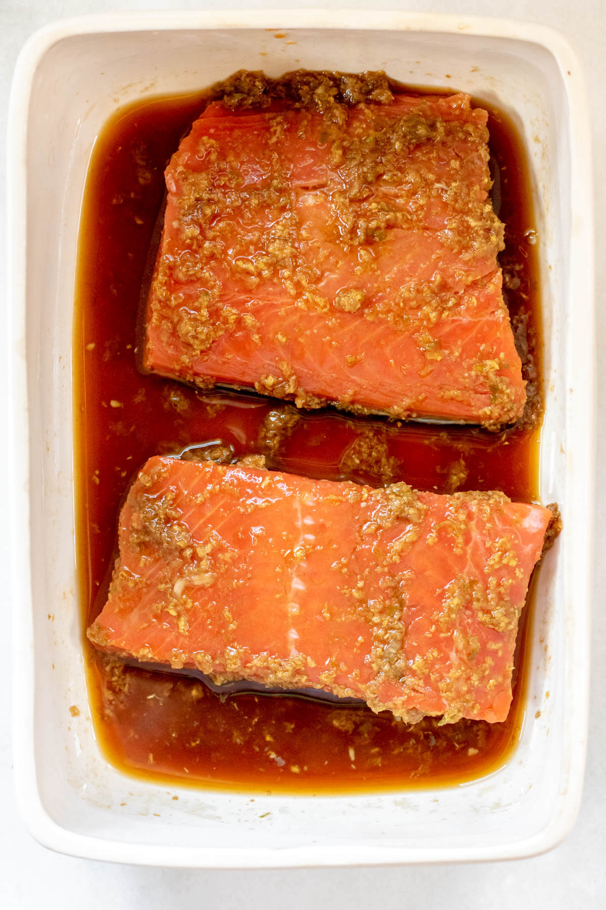 wild salmon marinating in ponzu sauce ginger, garlic, and honey