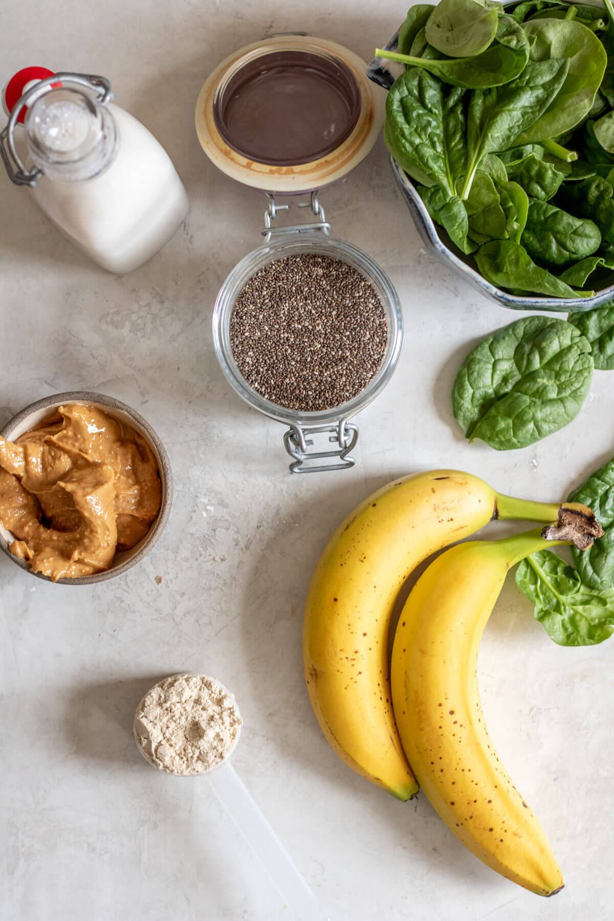 Ingredients for a green smoothie on a white background
