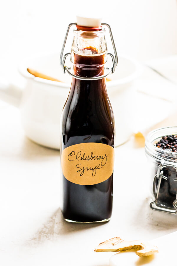 glass jar of elderberry syrup