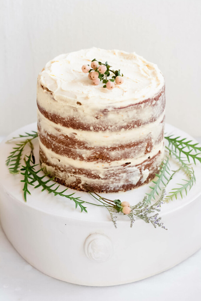 3 layer sweet potato cake on a white cake stand