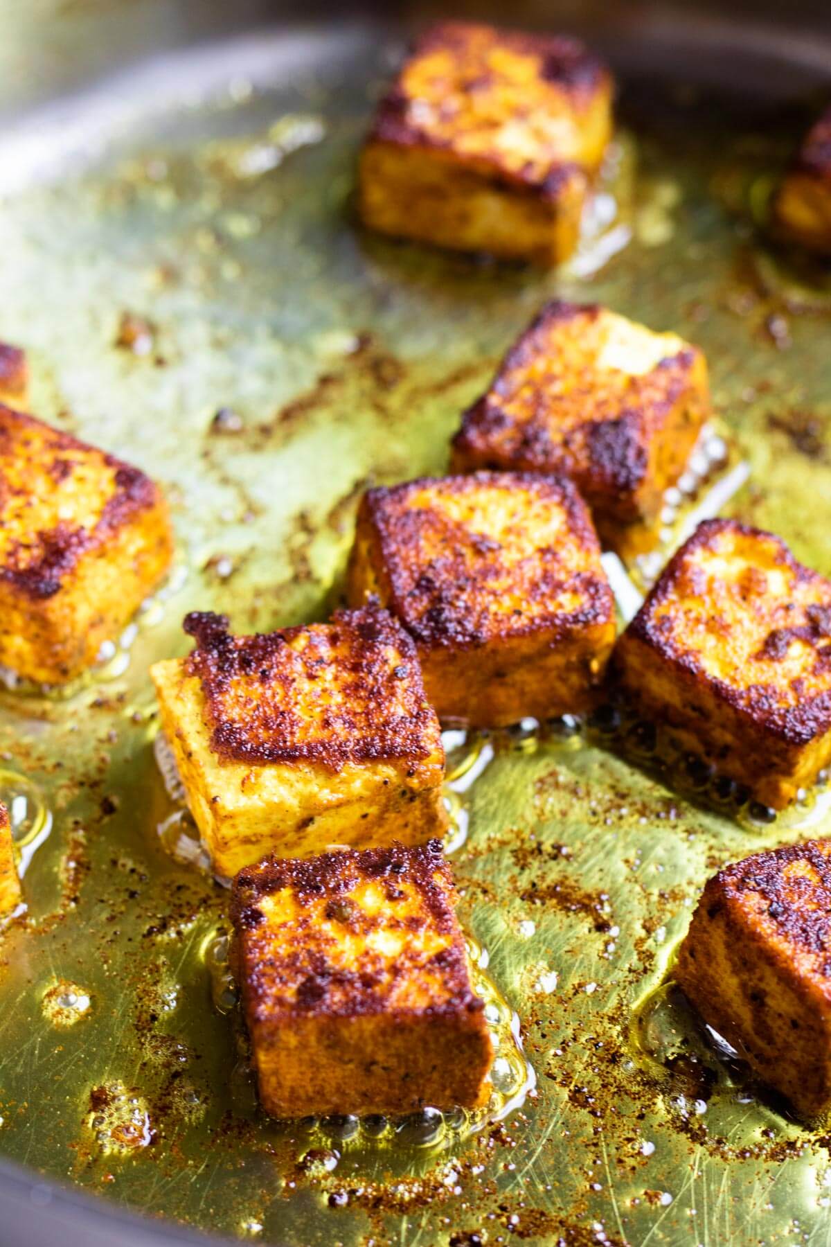 Turmeric coated paneer fried in ghee