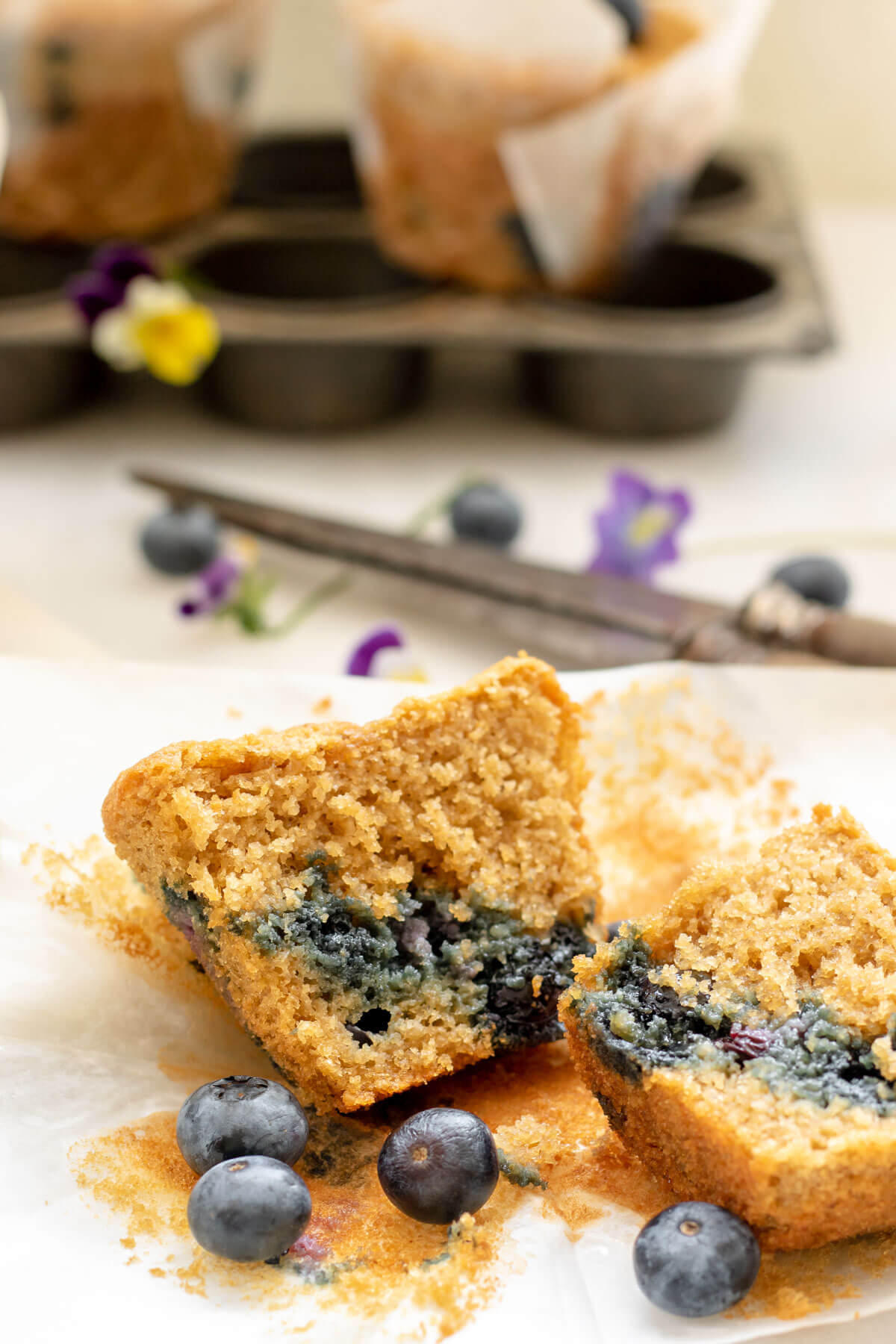 a cut open blueberry muffin