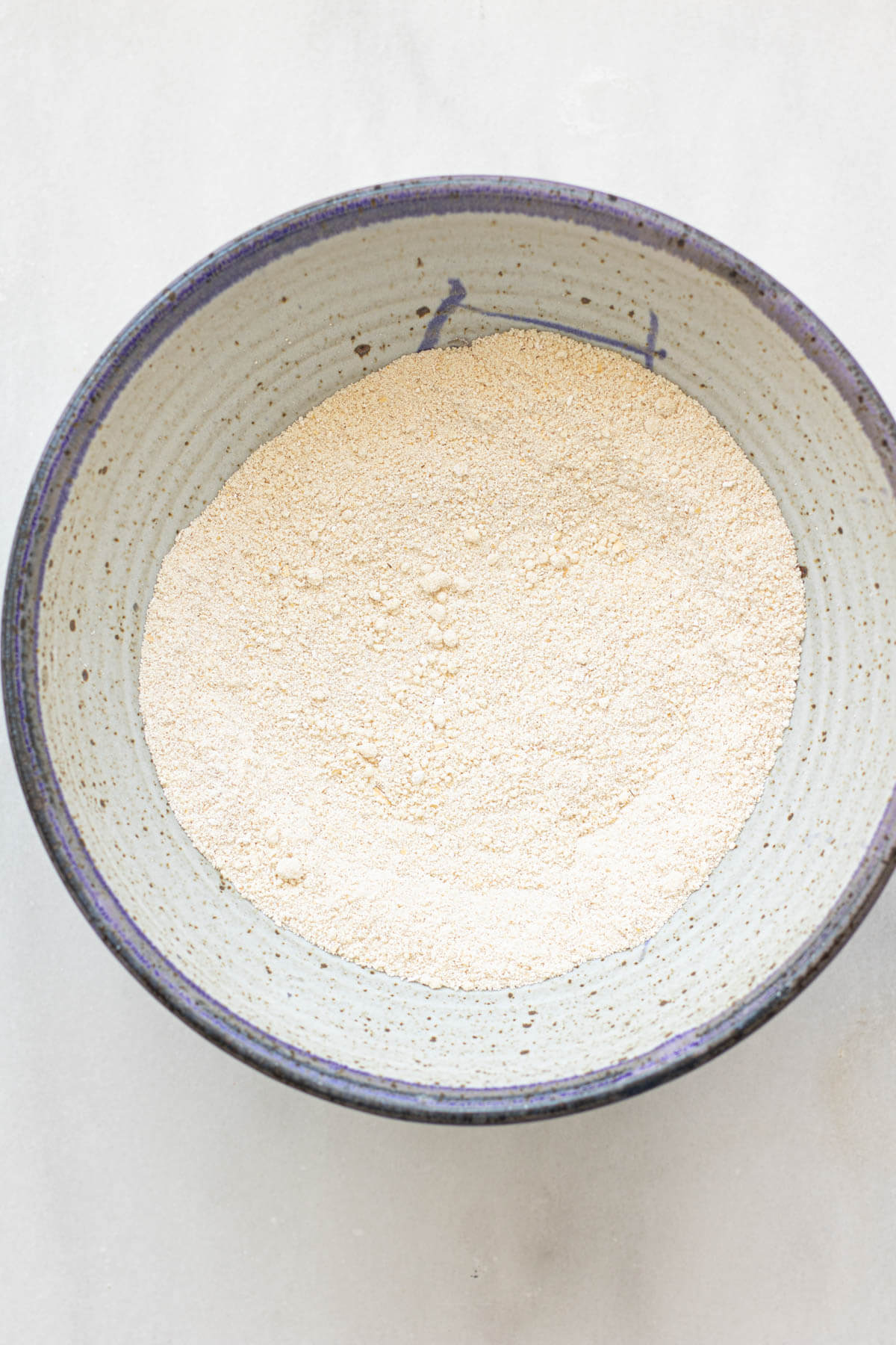 A bowl of dry ingredients ready to make blueberry muffins
