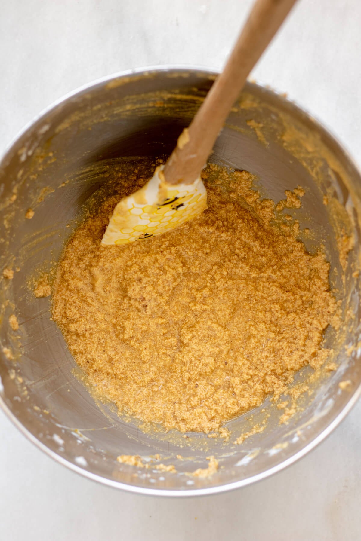 a bowl of whipped butter and sugar ready to make blueberry muffins