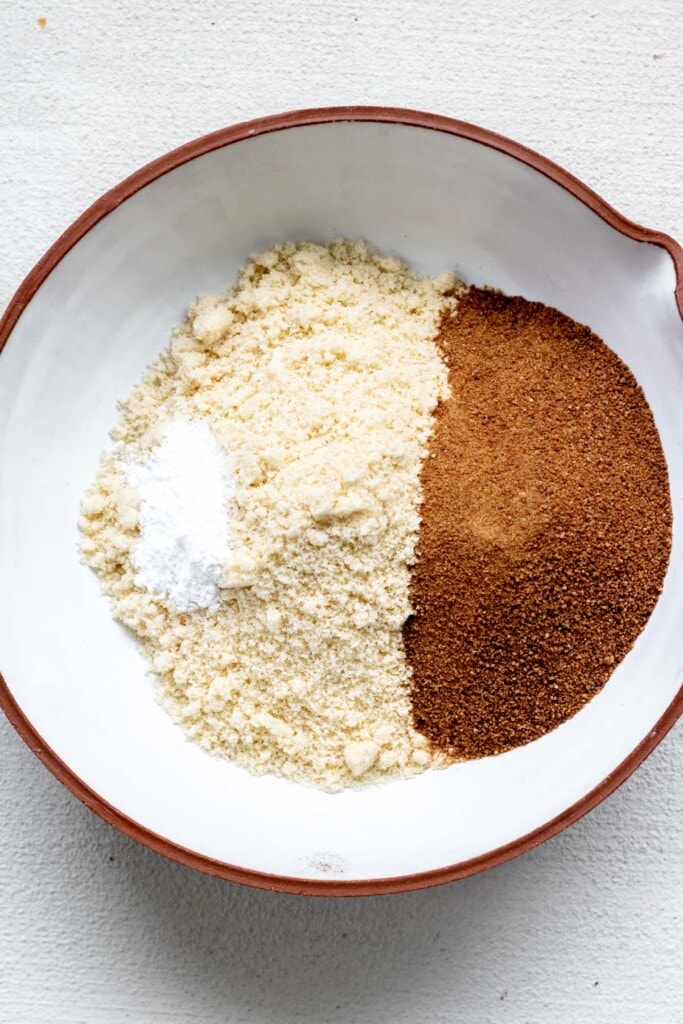 white bowl of almond flour and sugar
