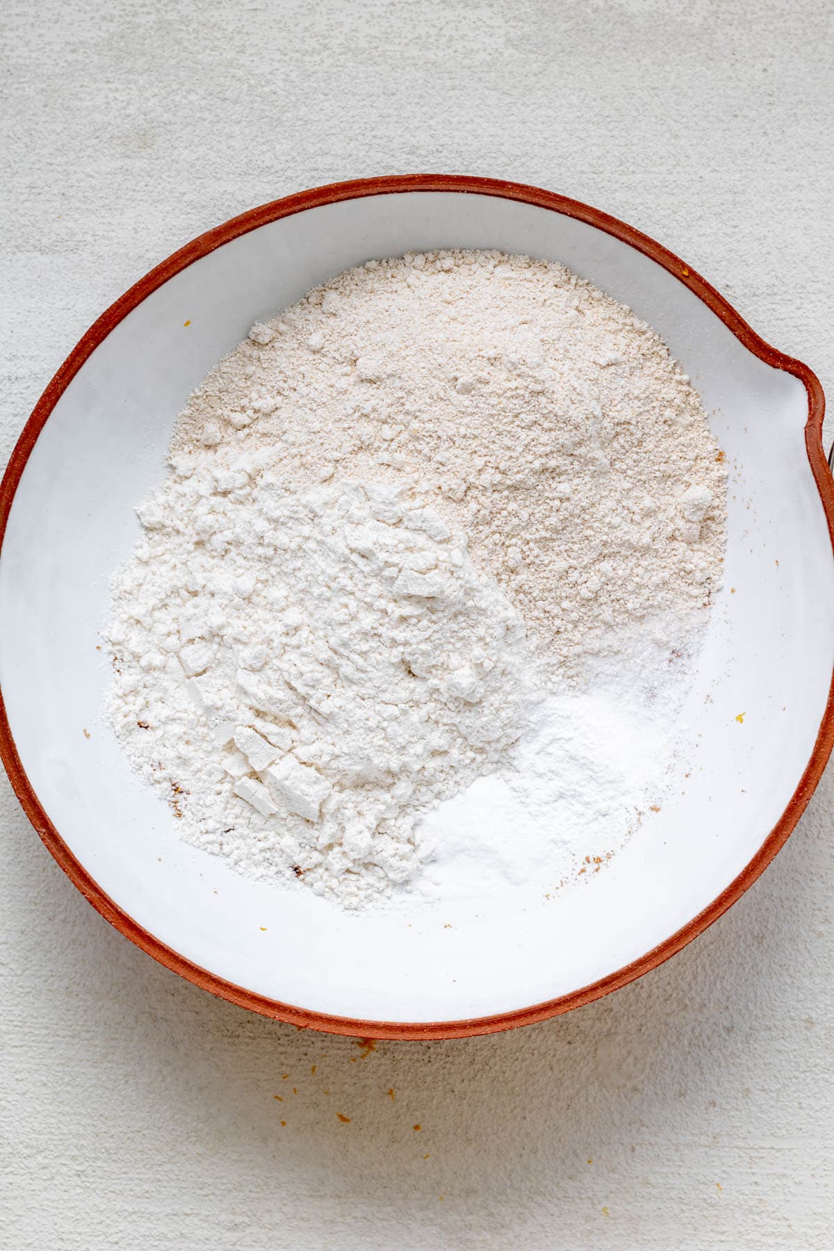 bowl full of dry ingredients for gluten free orange muffins