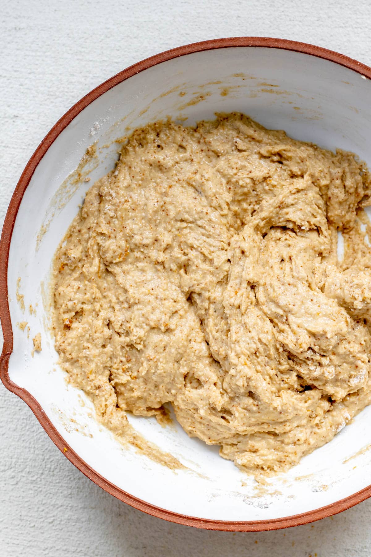 bowl with gluten free orange muffin batter