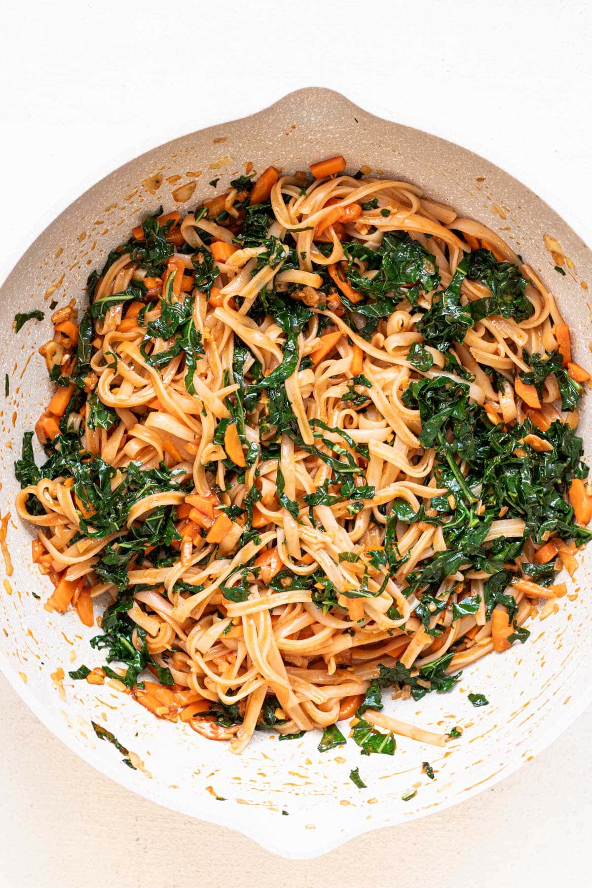 close up of saucy gochujang noodles in a pan