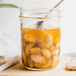 Mason jar full of honey fermented garlic