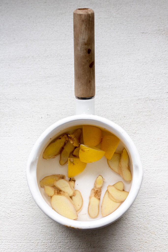 a pot of lemon and ginger boiling for tea