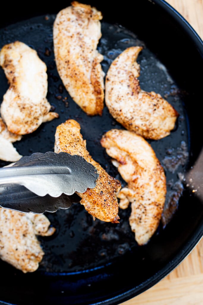 perfectly seared chicken breast in a cast iron skillet