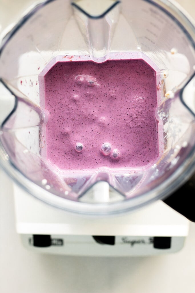 blender filled with blueberry cottage cheese smoothie