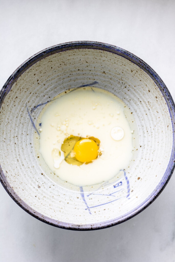 egg, milk, and oil in a bowl