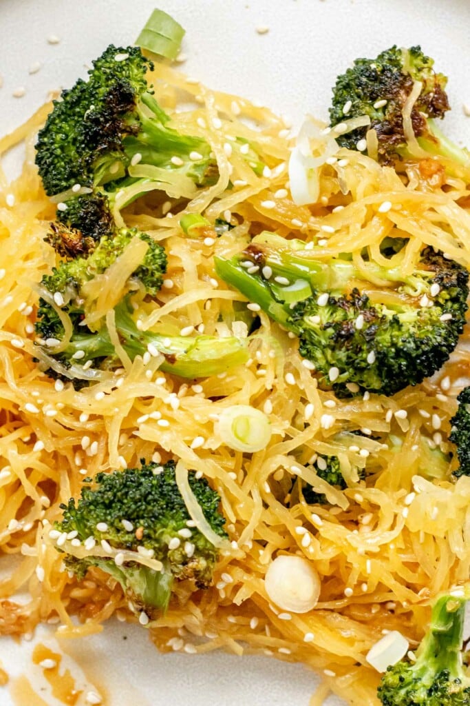spaghetti squash noodles covered in sesame seeds and broccoli