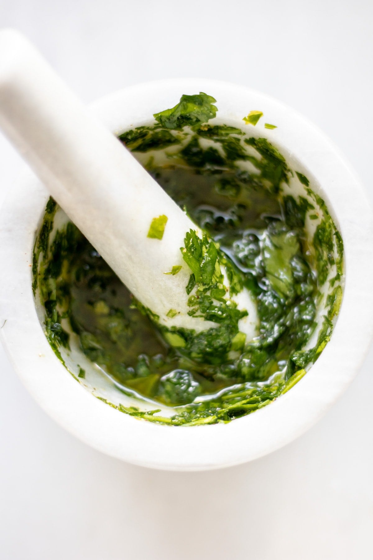 herb dressing in a mortar and pestal