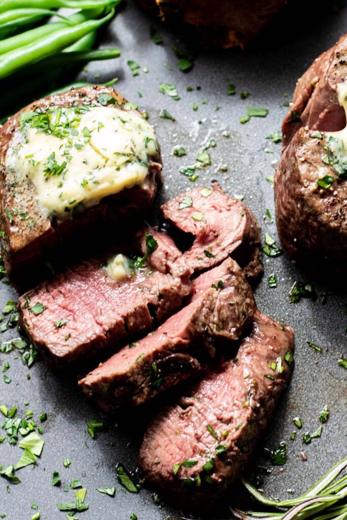 sliced steak with butter