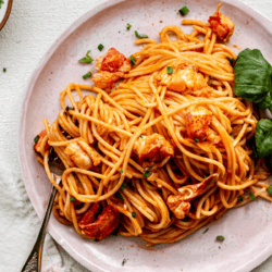 Lobster pasta on a plate with basil