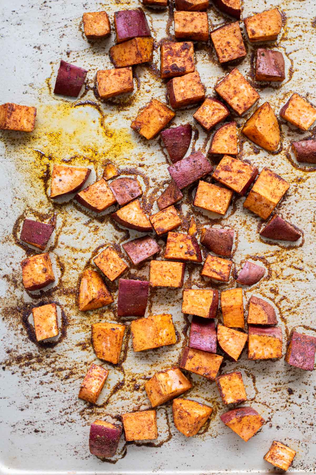 Roasted sweet potatoes on a baking sheet.