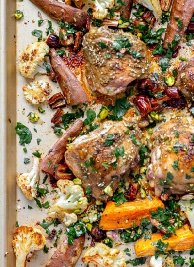 a sheet pan of spiced za'atar roasted chicken with sweet potatoes and cauliflower