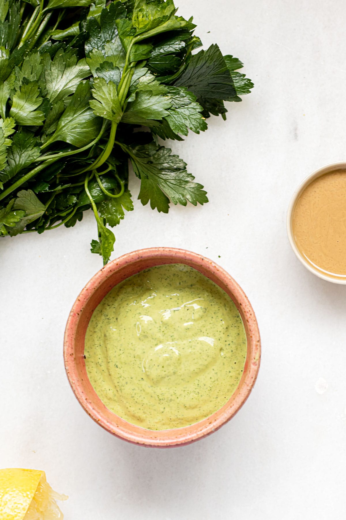 a small bowl of green tahini sauce