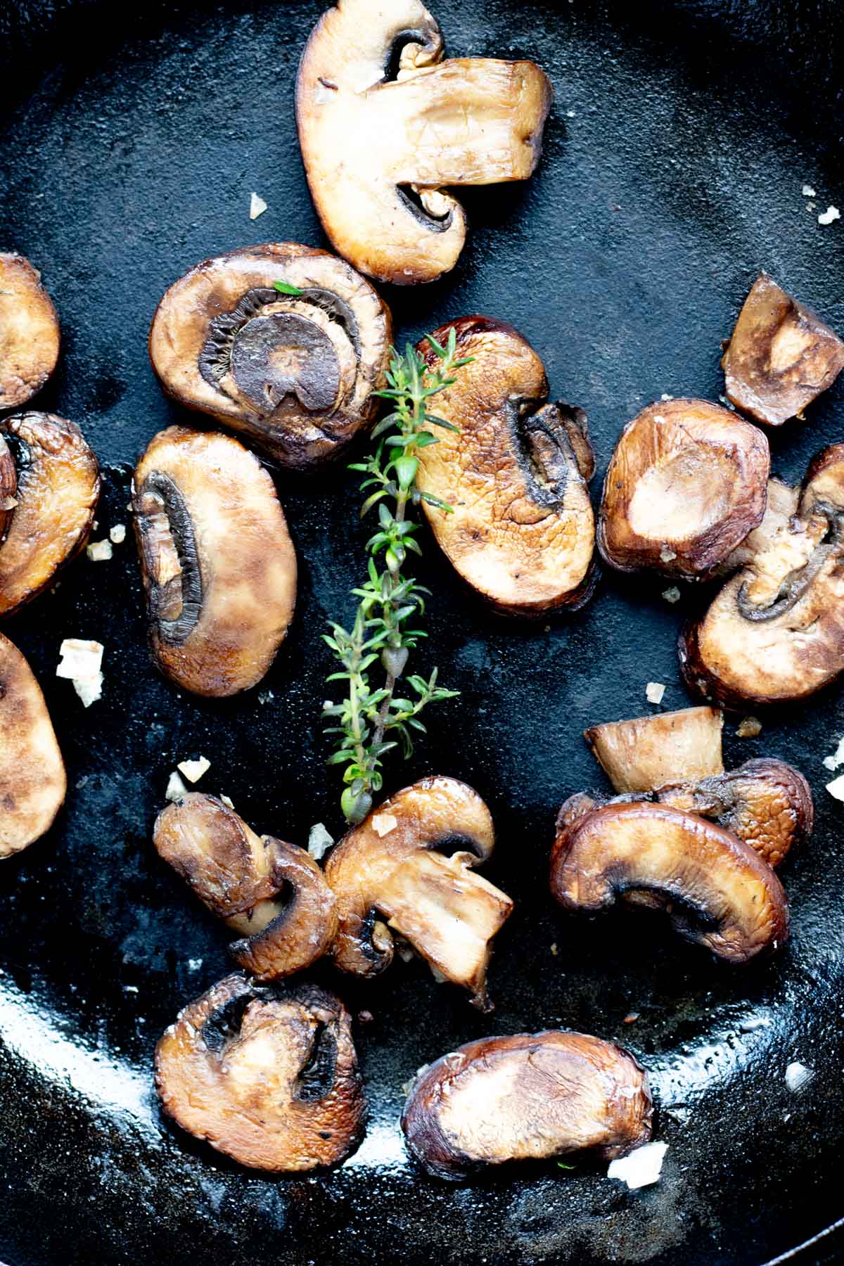 perfectly sauteed mushrooms in a cast iron skillet