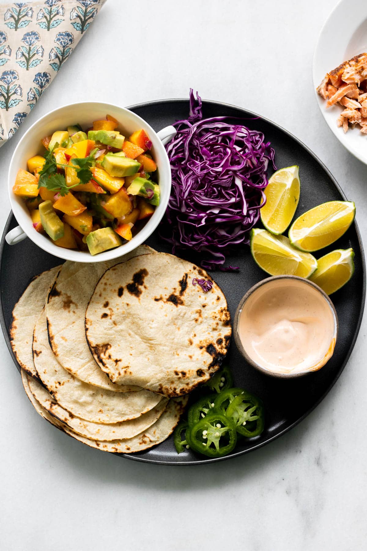 plate of corn tortillas and peach salsa