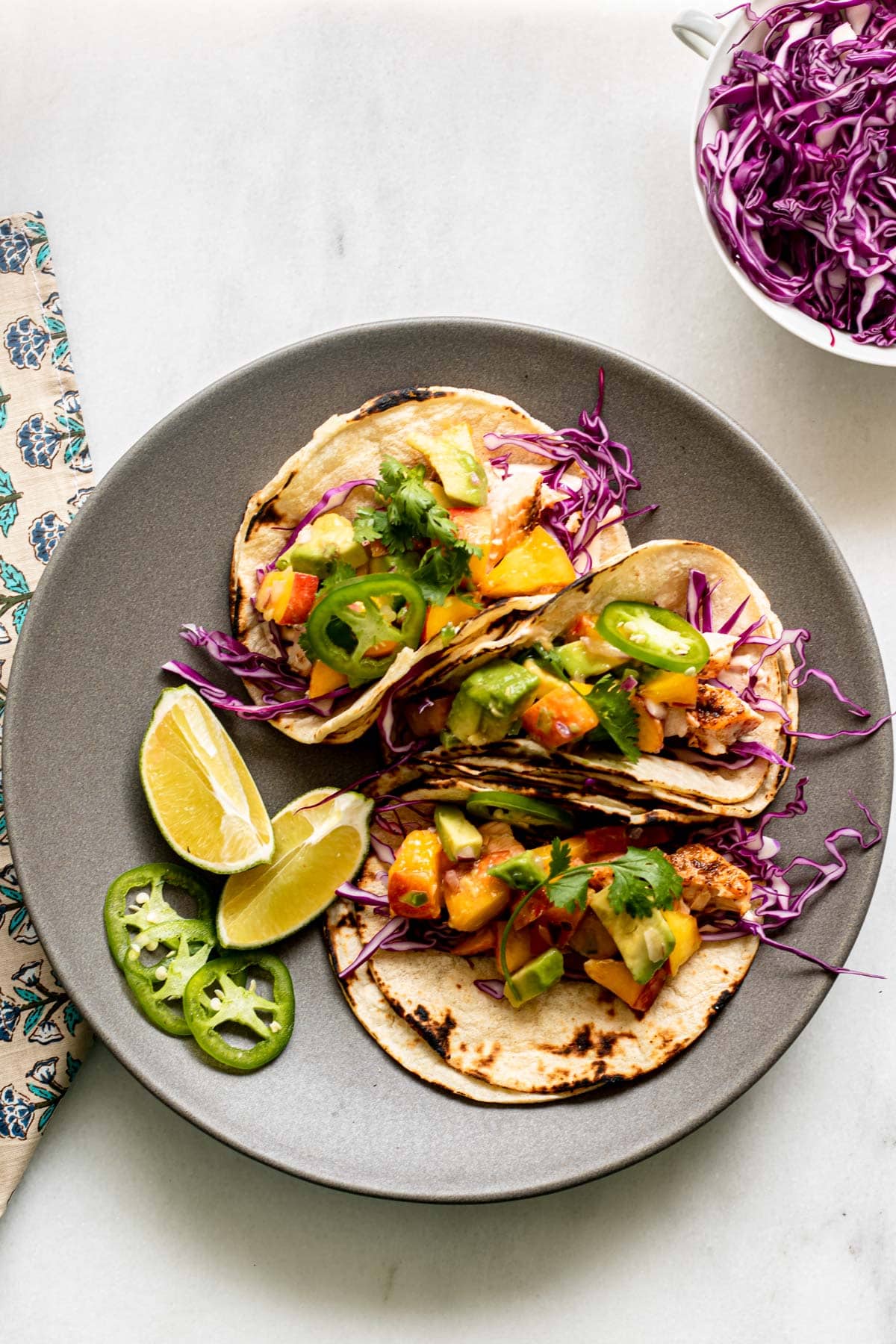 grey plate with salmon tacos