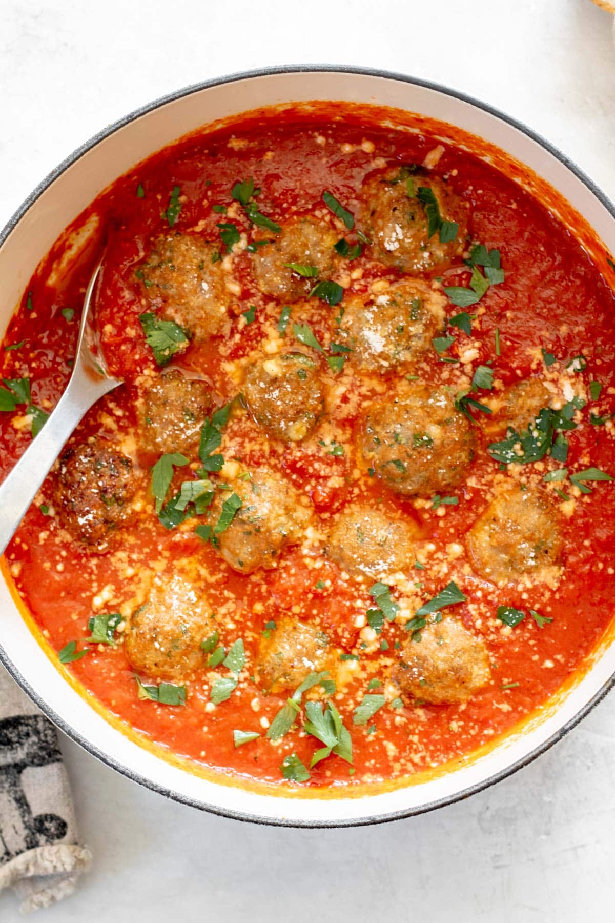 pot of simmering tomato sauce with air fryer turkey meatballs