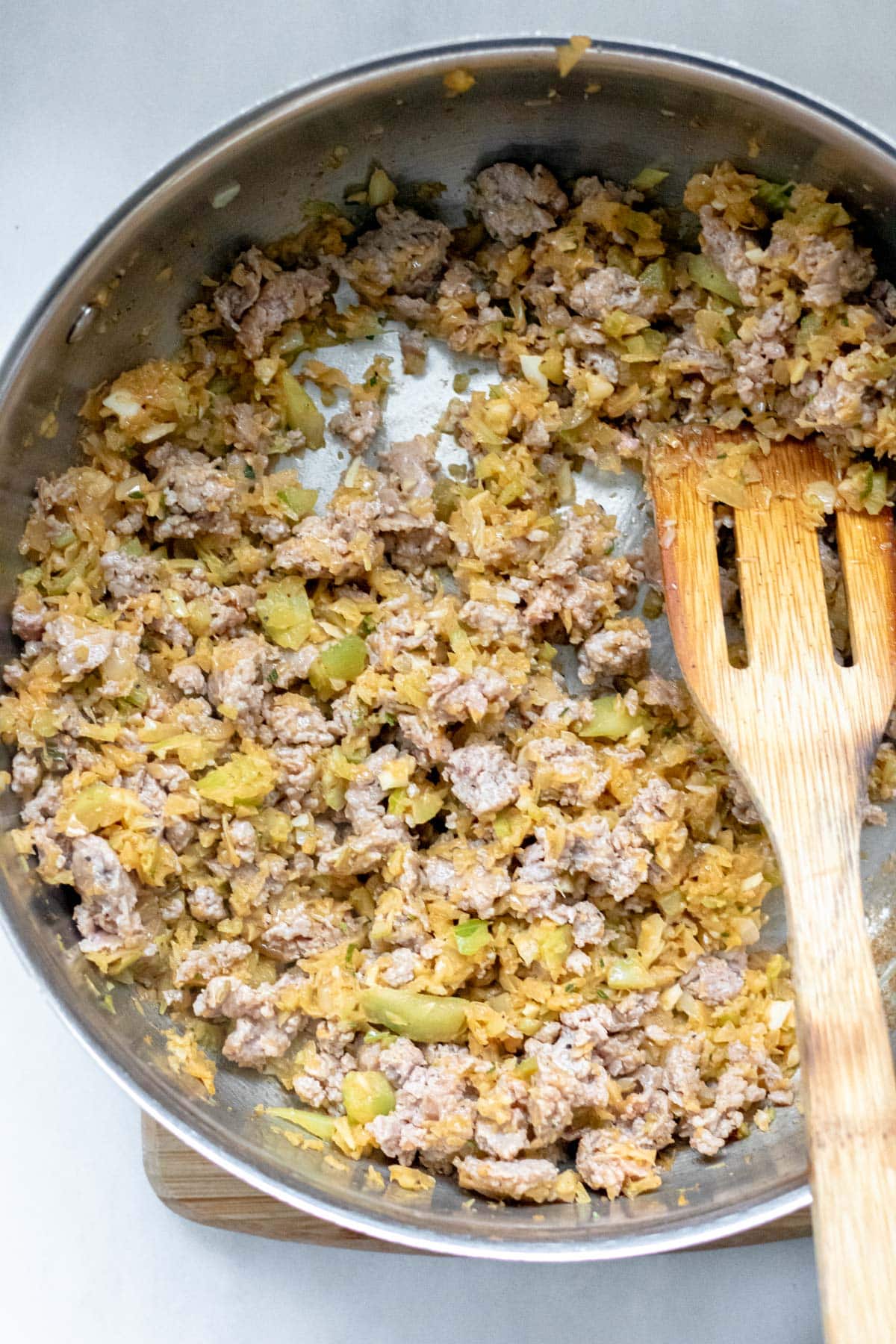 skillet of sausage and onions and fennel