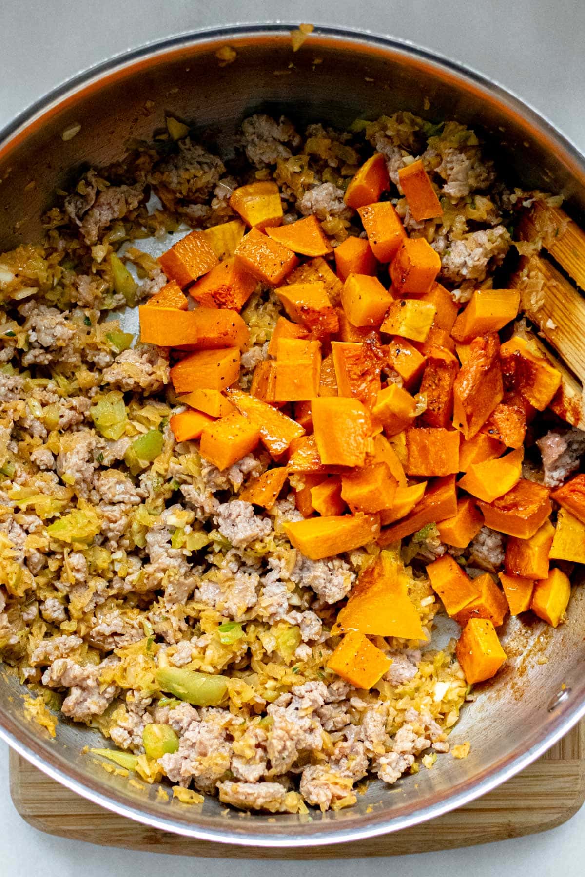 sauteed veggies and sausage in a skillet