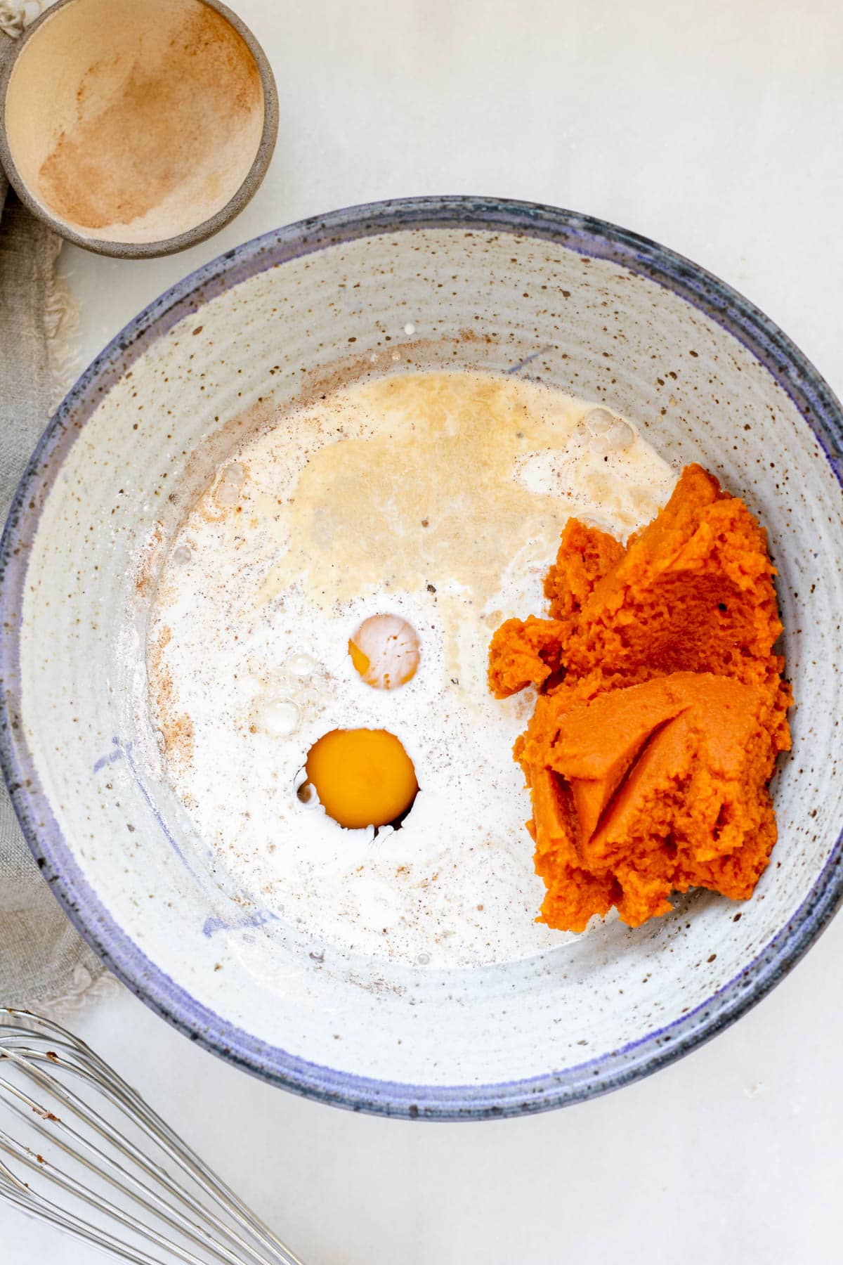 wet ingredients in a bowl for crustless pumpkin pie