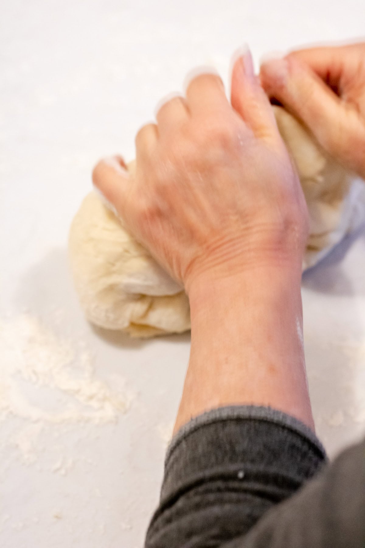 hand gently kneeding Hungarian Kiffle dough