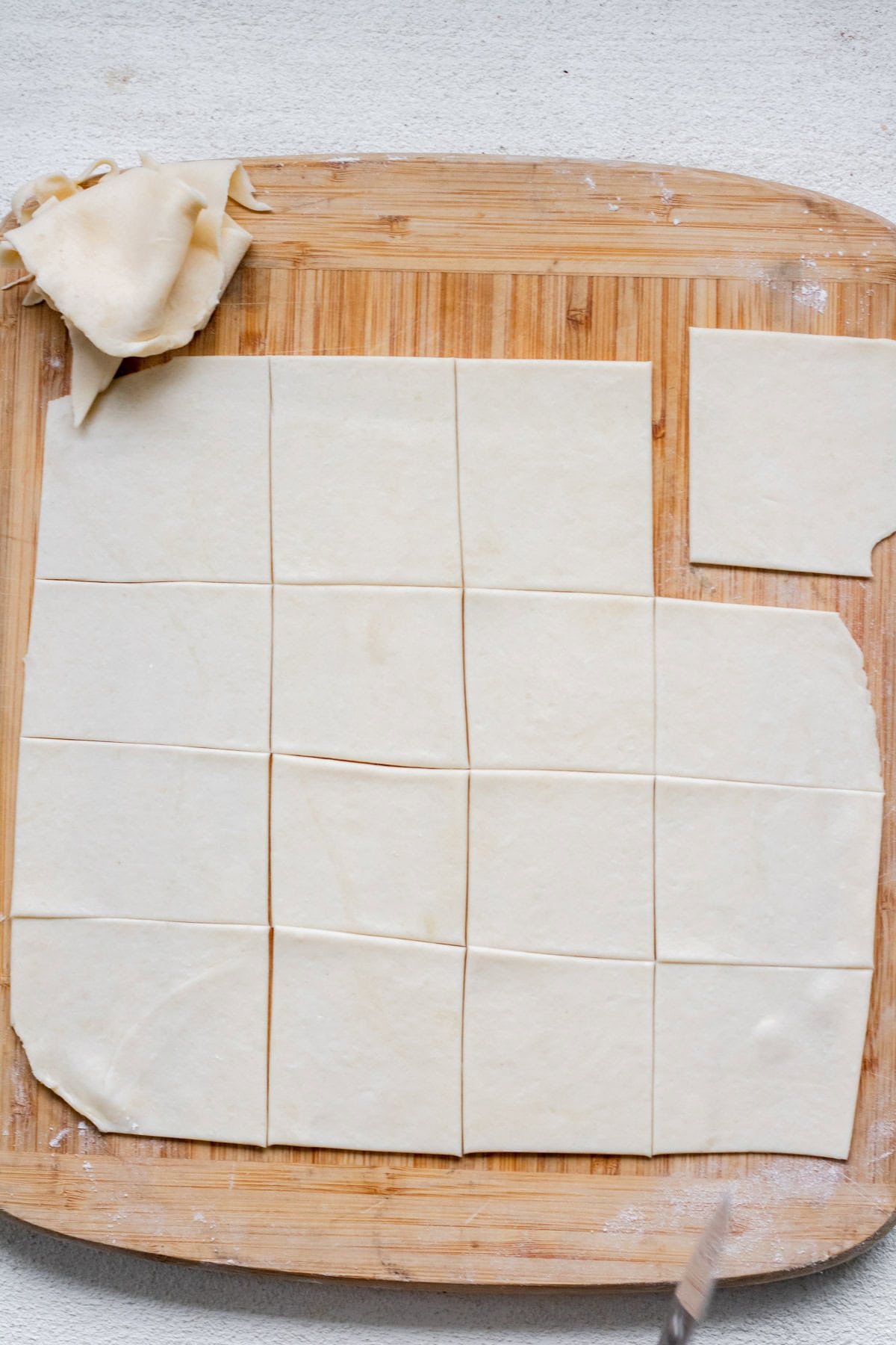 squares of kiffle dough rolled out ready for filling