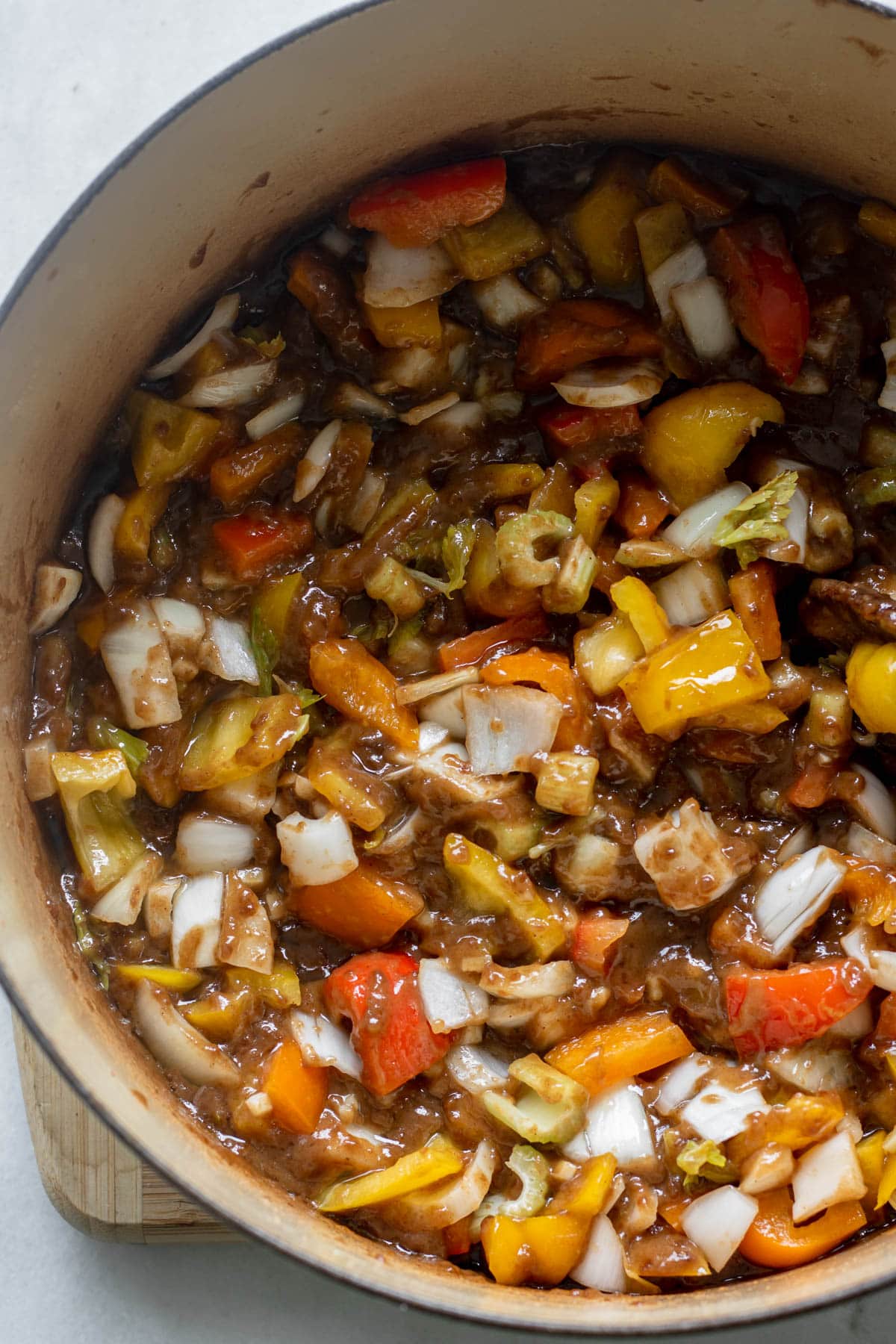 stirring vegetables into dark roux for gluten free gumbo