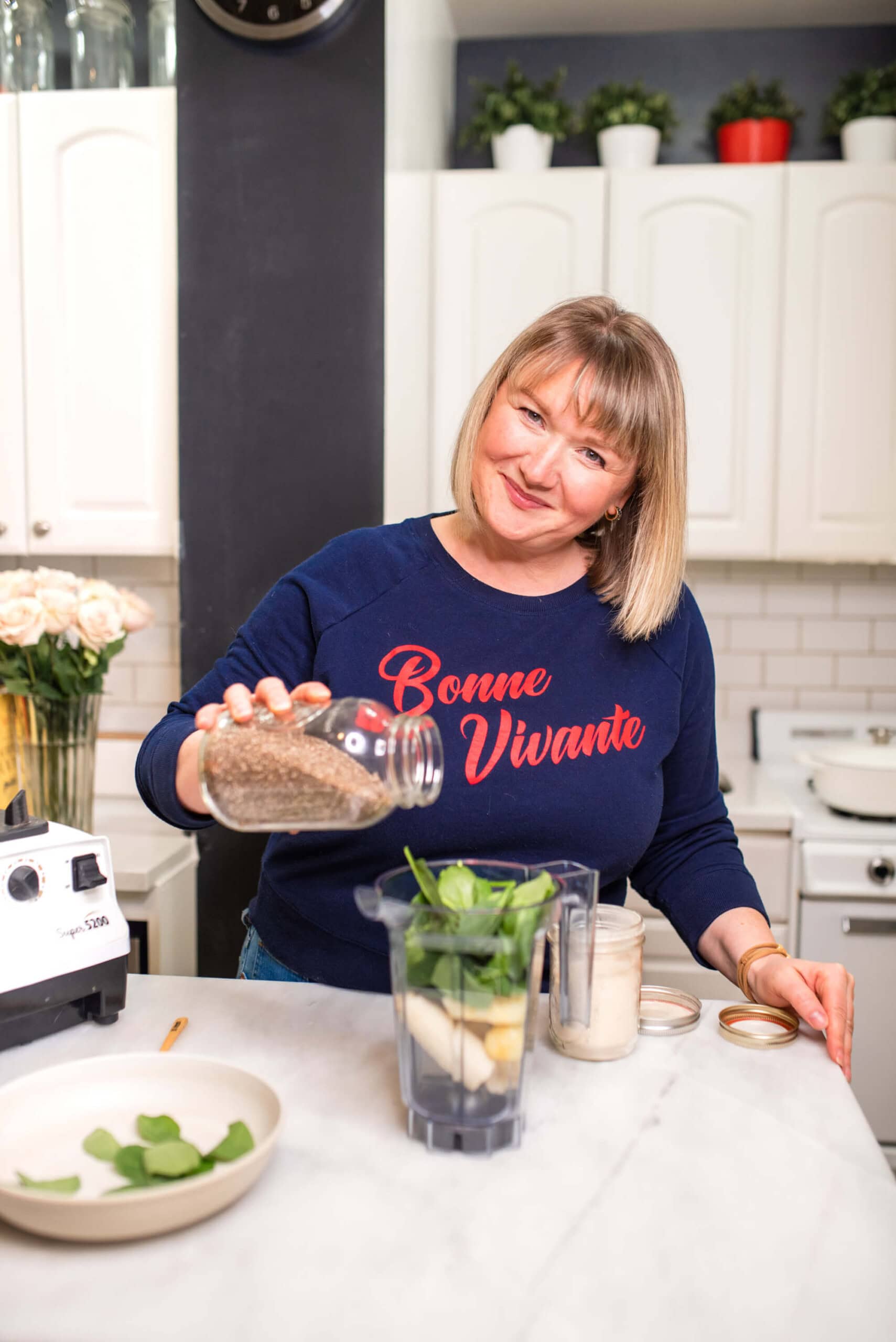 nutritionist adding protein to smoothies