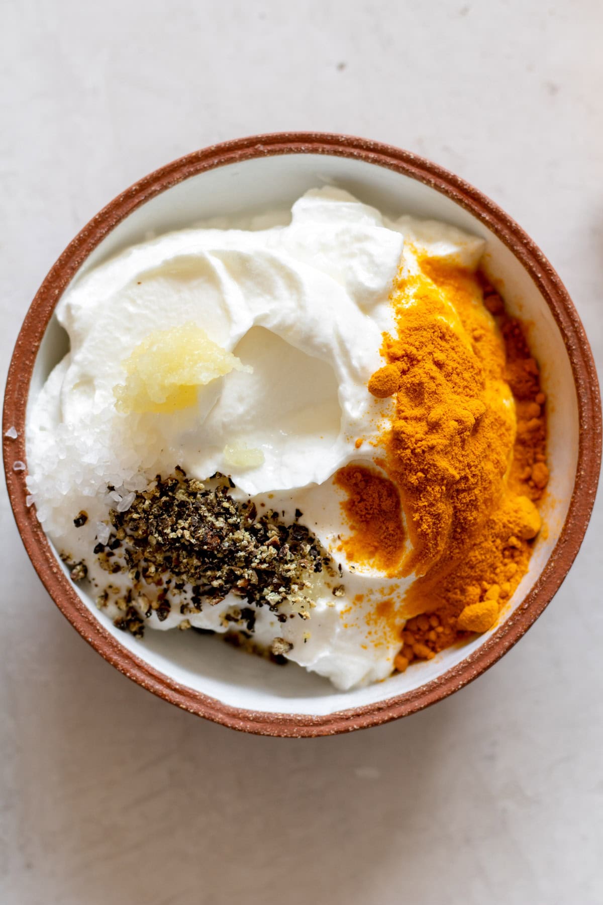 turmeric garlic yogurt sauce about to be stirred