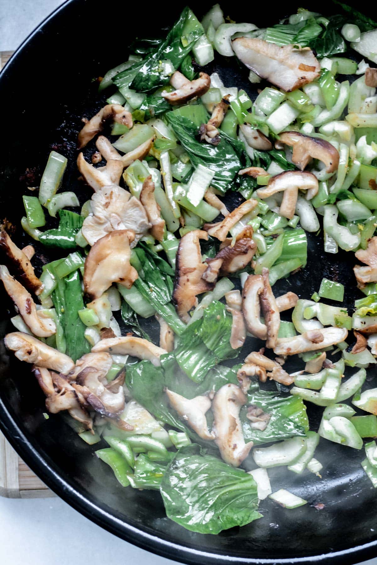 shiitake mushrooms and bok choy in saute pan