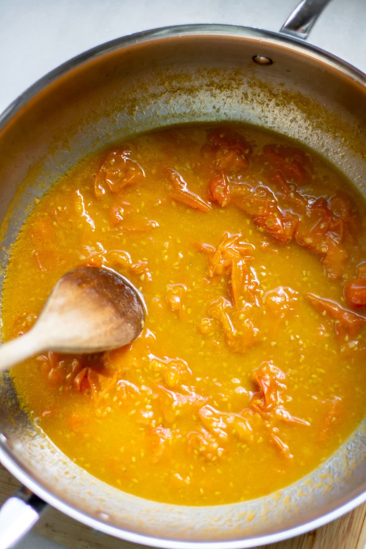 sungold tomato sauce in a pan cooking down