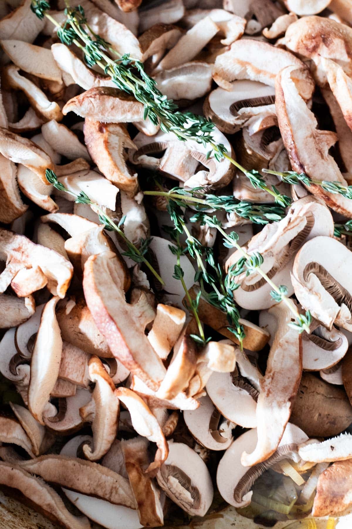 mushroom slices with rosemary twigs