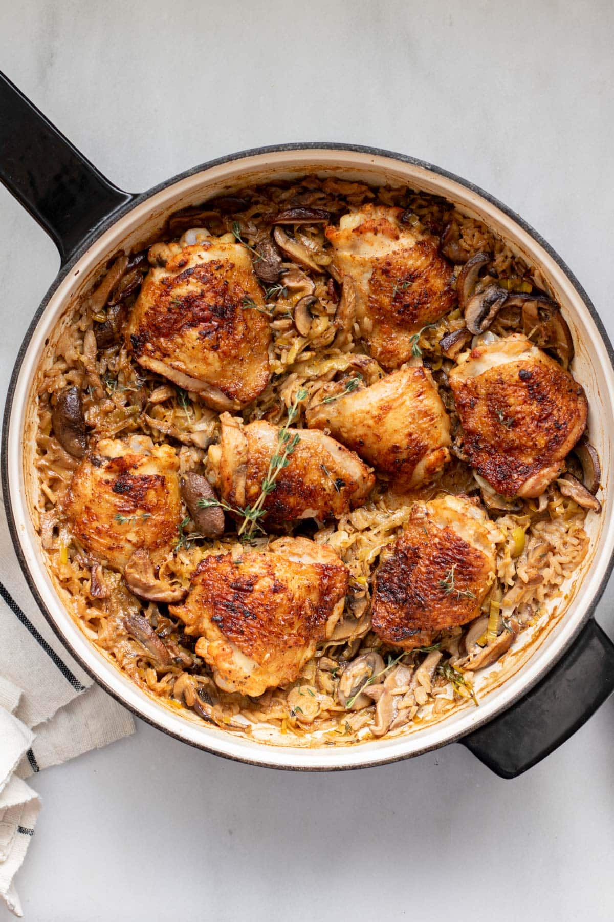 mushroom leek chicken and rice in a pan