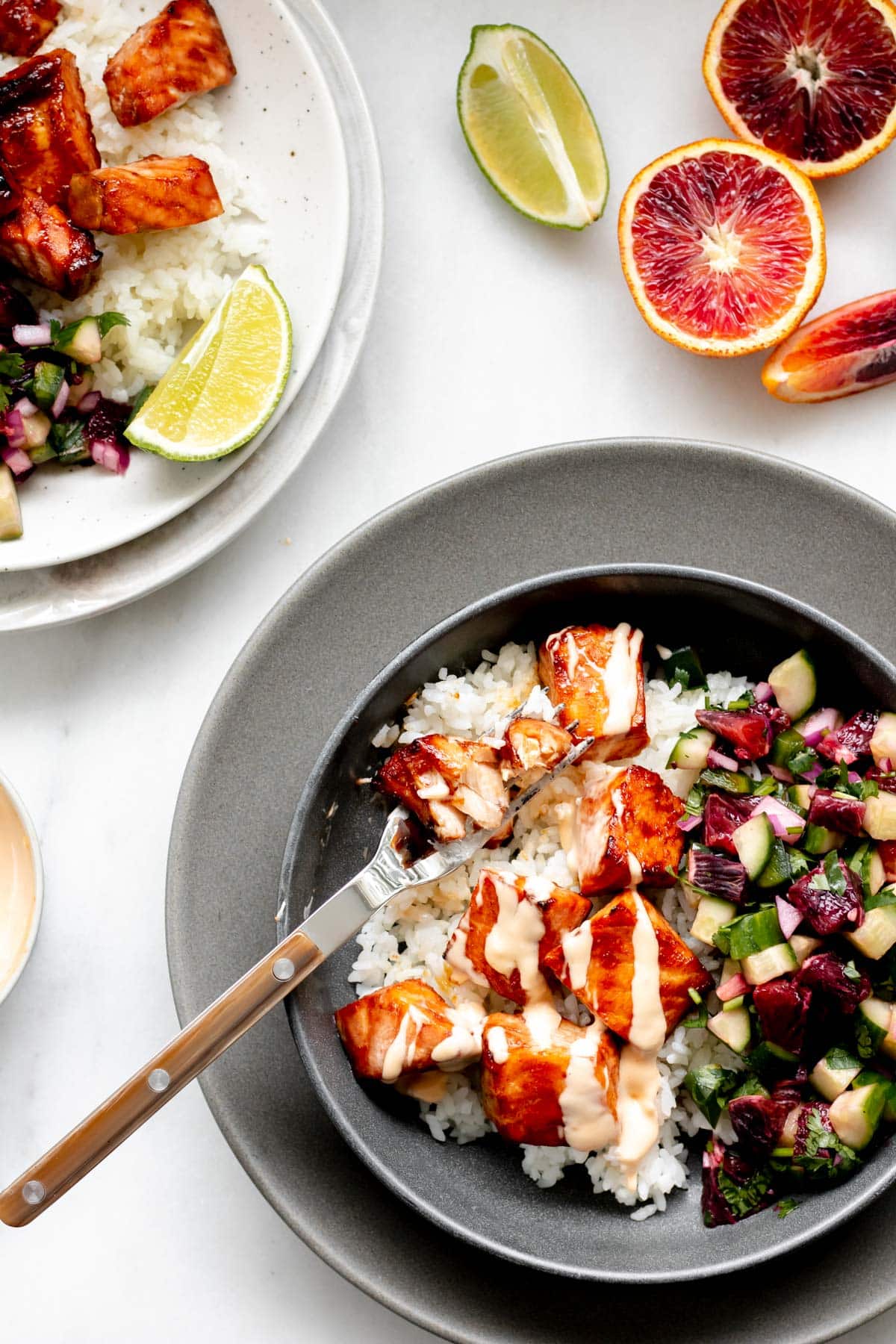 hot honey salmon bowl with bang bang sauce drizzle