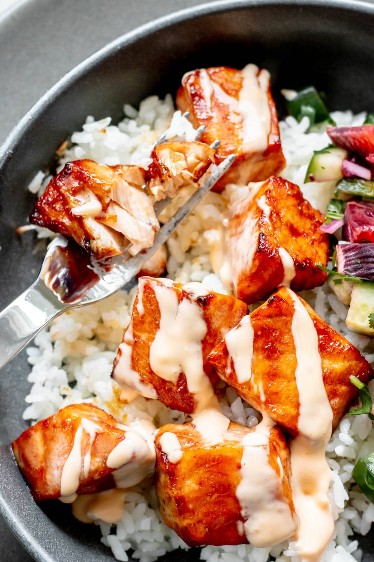 close up of a salmon chunk on a fork
